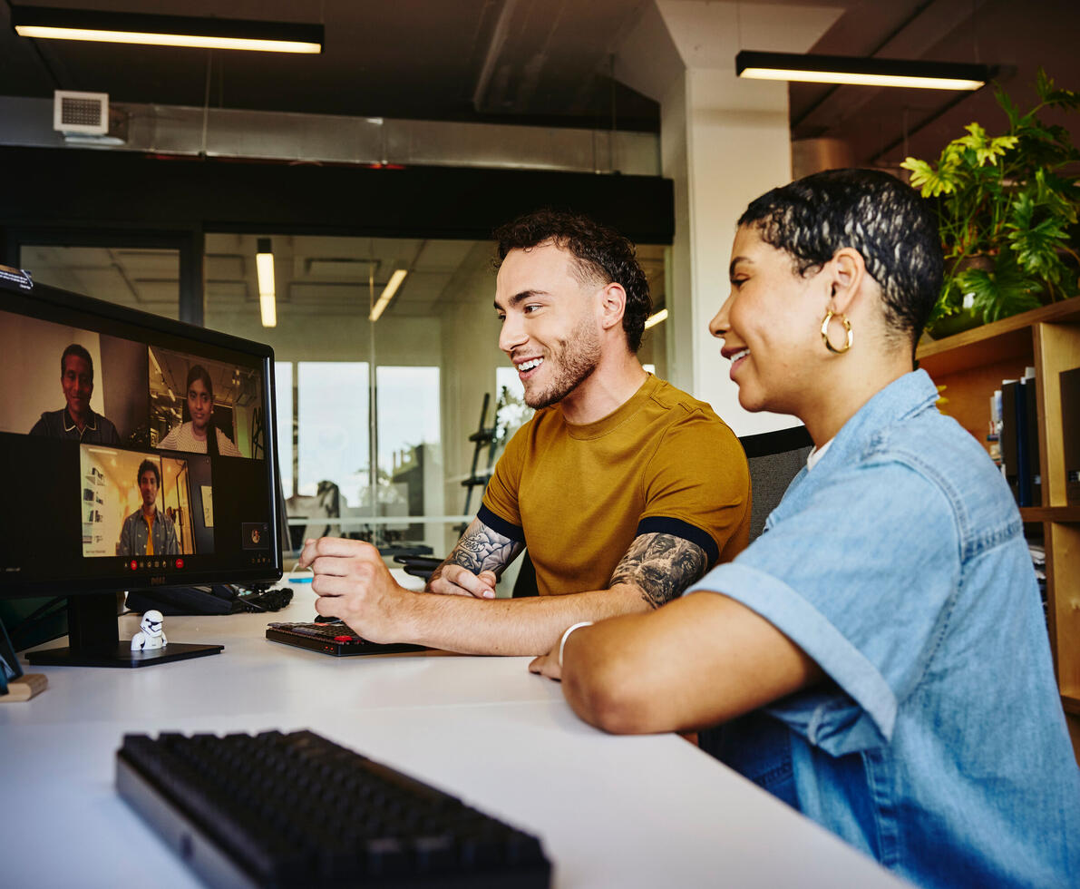 two persons working on a desk